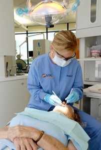 Dental Hygienist looking at a patient