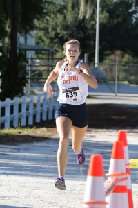 Grace Miller cross the finish line first, winning the SFSC Cross Country Invitational for the Lady Panthers.