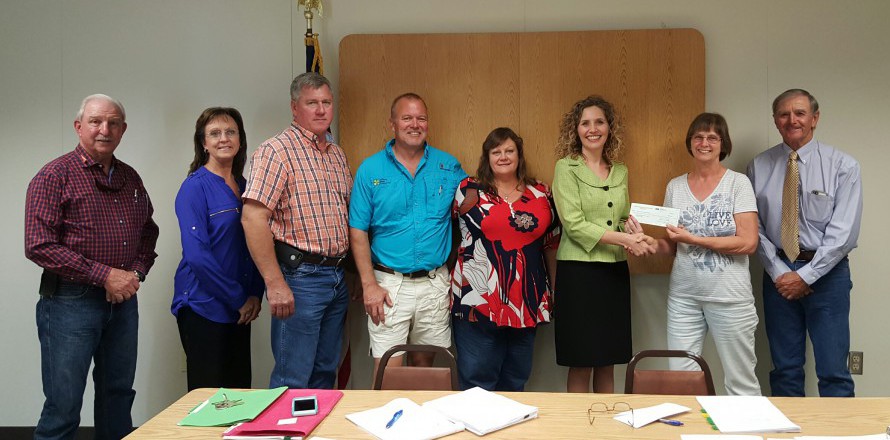 On behalf of the SFSC Foundation, Jamie Bateman (third from right) accepts the Highlands County Soil and Water District’s scholarship donations from HSWCD supervisor Jackie Bailey. Also present are (from left) Highlands County Commissioner Jim Brooks, HSWCD executive director Susie Bishop, supervisors Doug Deen, Scott Kirouac, and Pam Fentress, and chairman Dr. John Causey. 