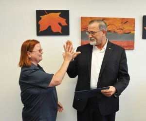 Lena Phelps, membership coordinator for the SFSC chapter of the Florida Association of Colleges congratulating Kevin Brown on his retirement.