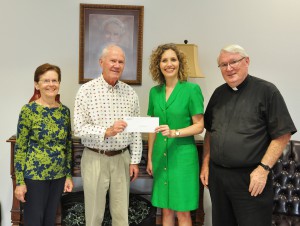 From left: Marilyn Conroy, Jim Conroy, Jamie Bateman, and Rev. Nicholas McLaughlin at Our Lady of Grace Catholic Church.