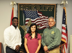 From left, Adson Delhomme, Jazmin Gonzalez, and sheriff Arnold Lanier at the Hardee County Sheriff’s Office.