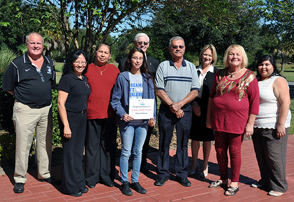 (From left) Todd Baldwin, principal, DeSoto County High School; Irene Castanon; Maria Rivera, Diana’s mother; Diana Rivera; Adrian Cline, superintendent of schools, School District of DeSoto County; Francisco Rivera, Diana’s father; Asena Mott, director, SFSC DeSoto Campus; Sheila Knoche; and Danielle Ochoa, Take Stock college success coach, DeSoto County