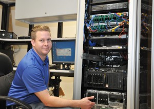 Protasio at work in front of the server rack at the city of Sebring.