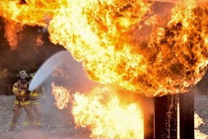 Firefighter putting out a fire