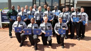 Group photo of the 19 graduates of the Basic Corrections Class 21-104