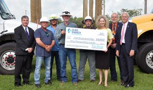 Duke Energy representatives presented a check for $30,000 to South Florida State College for its Electrical Lineworker program. Pictured (from left): Dr. Sidney Valentine, SFSC vice president for academic affairs and student services; Chris Yeomans, SFSC electrical distribution professor; Tanner Bell, Duke’s Highlands Operation Center lineworker; Kirby Whitehouse, Duke’s Highlands Operation Center lineworker; Chris Stutler, Duke supervisor of customer delivery operations; Jamie Bateman, SFSC executive director for institutional advancement; Erik Christensen, dean of applied sciences and technologies; and Dr. Thomas C. Leitzel, SFSC president.