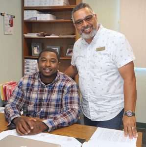 Antonio James and Eddie Cuencas in Antonio's office.