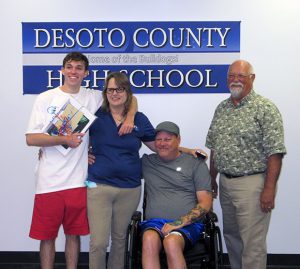 Braden Beaney with parents and TSIC mentor