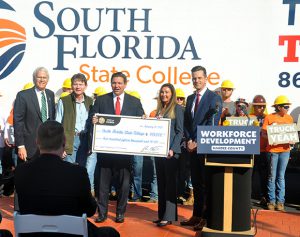 Gov. DeSantis presents check to Dr. Thomas Leitzel