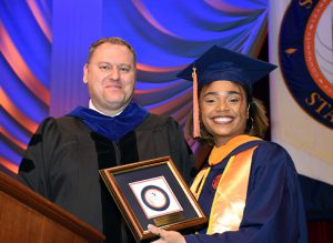 Dr. Mark Bukowski and Student Speaker Maddie Charles