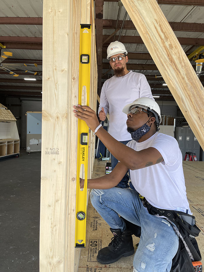 Students leveling a beam