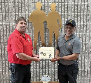 Joe Marble (left) and Michael Austin, SFSC Criminal Justice coordinators, with the Meritorious Award.