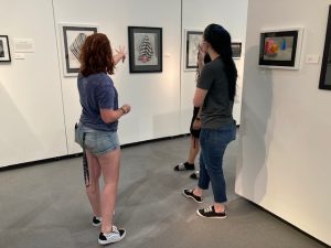 Students standing in the gallery