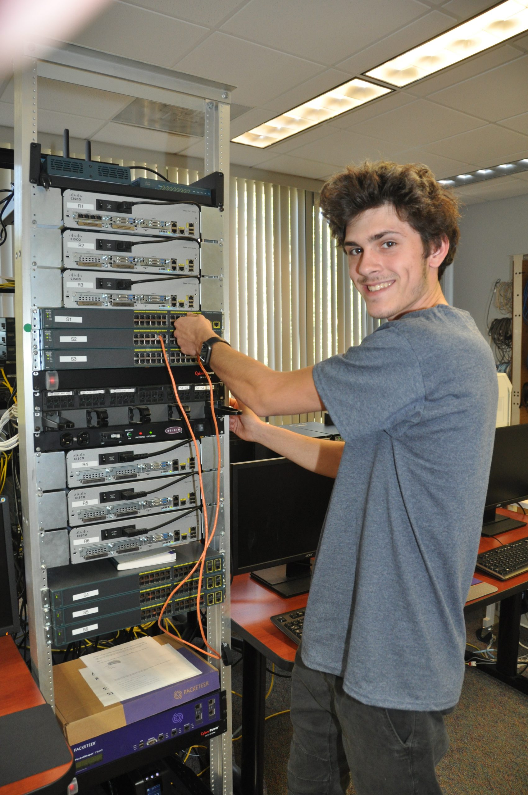 Student next to switches