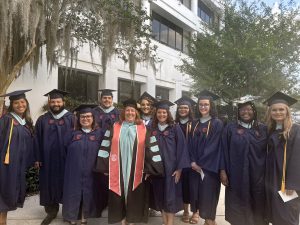 A group of graduates in caps and gowns. 