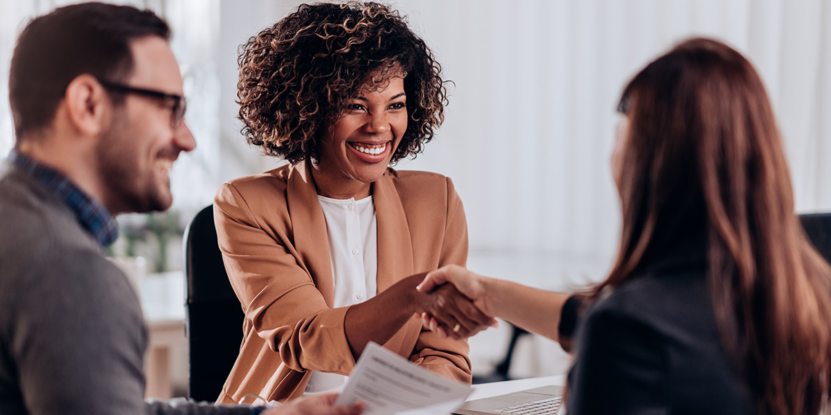 Candidate shaking hands with an interviewer during a job interview.