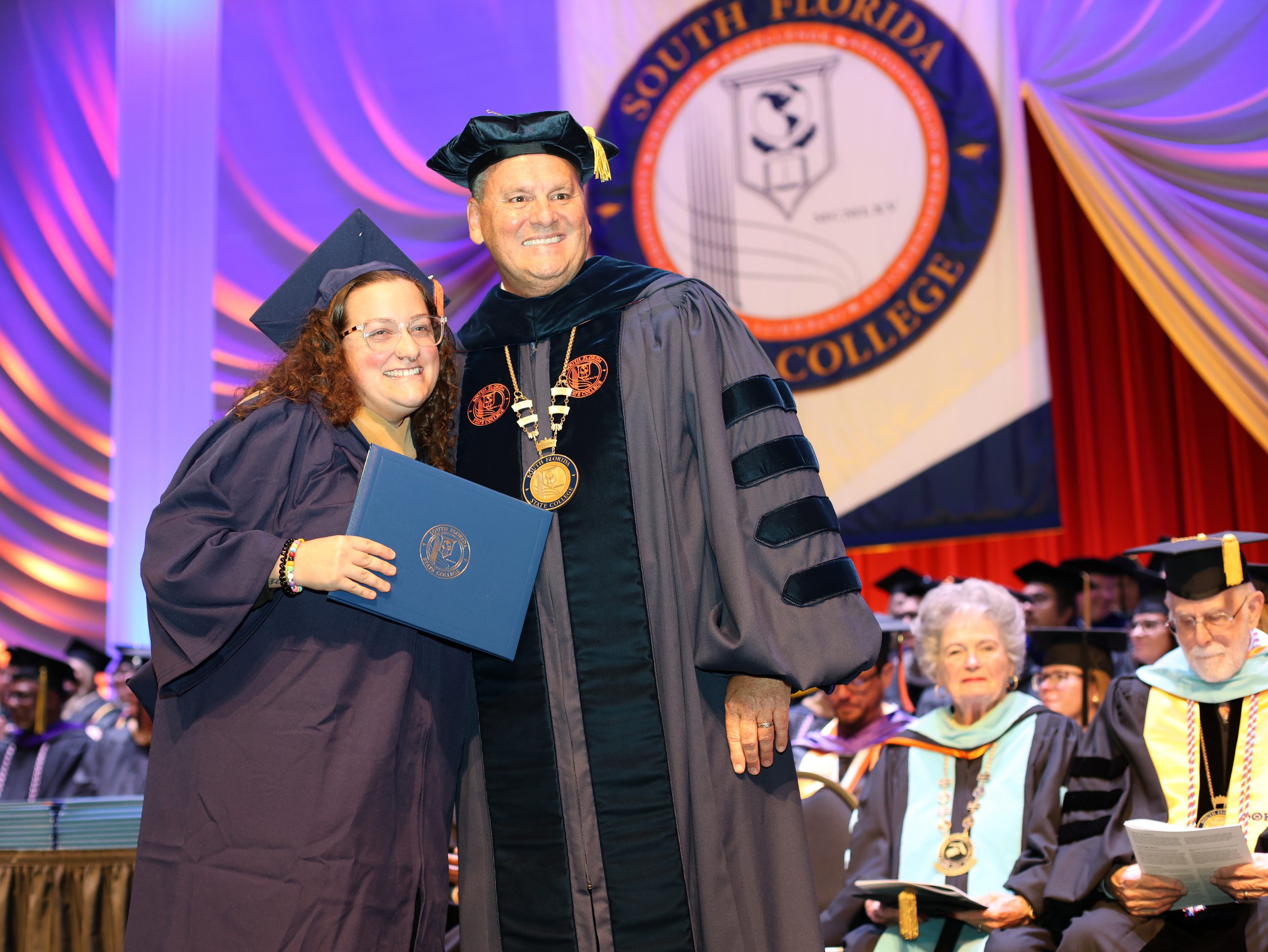 President Fred Hawkins with graduate