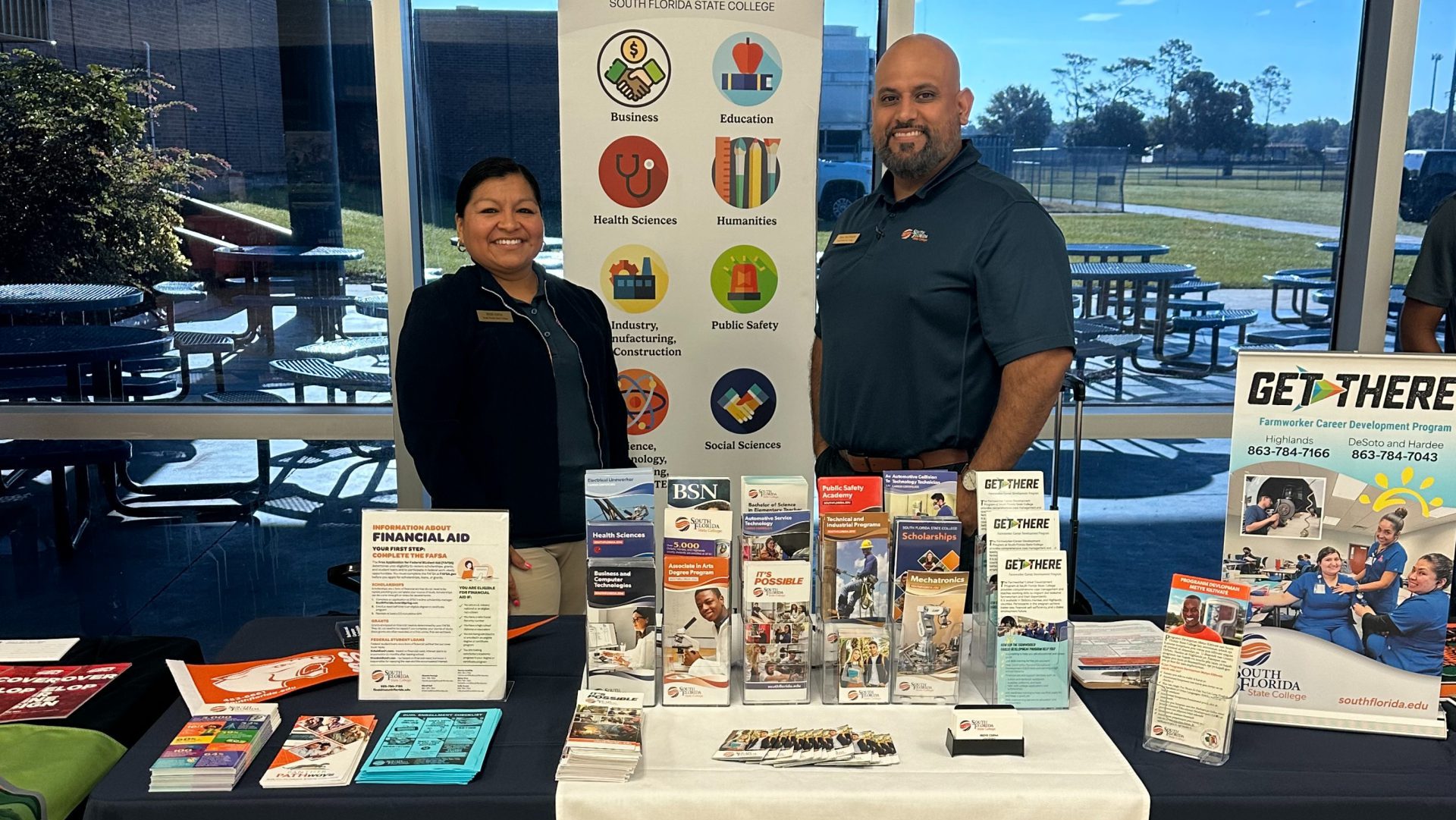 Two smiling employees