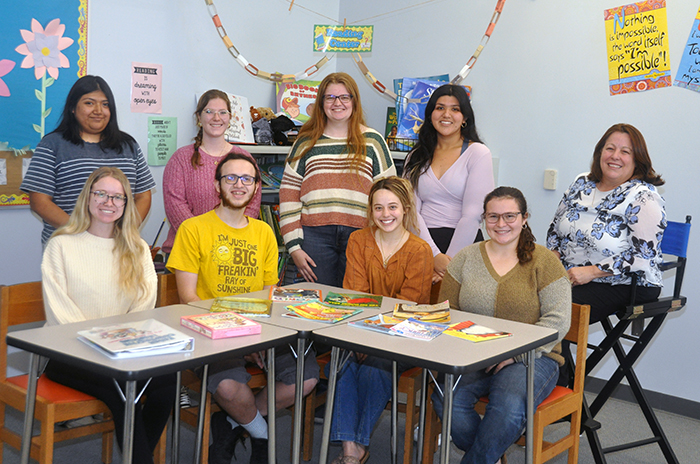 Dr. Maday Leon (far right) with students