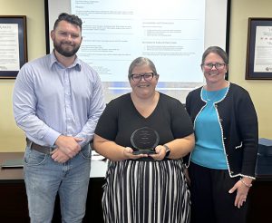 Cheryl John (center)